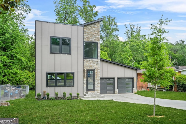 2318 Polar Rock Ter, Atlanta, GA 30315 - modern home with board and batten siding, stone siding, concrete driveway, and a front lawn