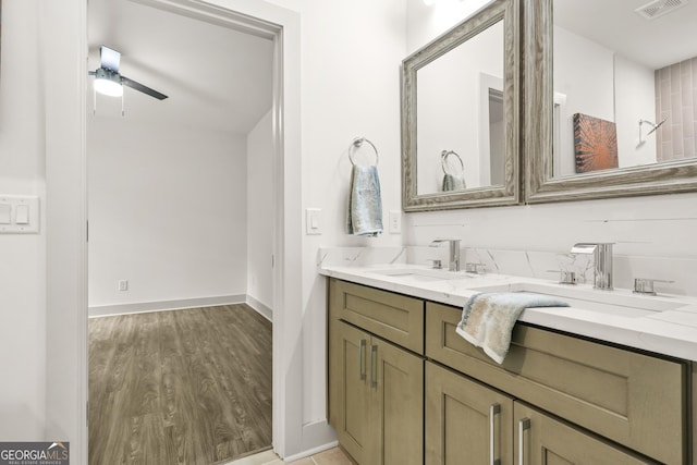 2318 Polar Rock Ter, Atlanta, GA 30315 - full bathroom featuring double vanity, wood finished floors, baseboards, and a ceiling fan