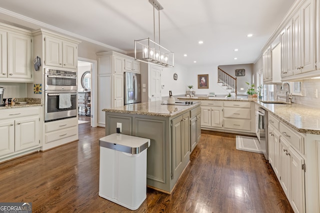 420 Windswept Ct, Roswell, GA 30075 - kitchen featuring a sink, appliances with stainless steel finishes, a peninsula, dark wood-style floors, and recessed lighting