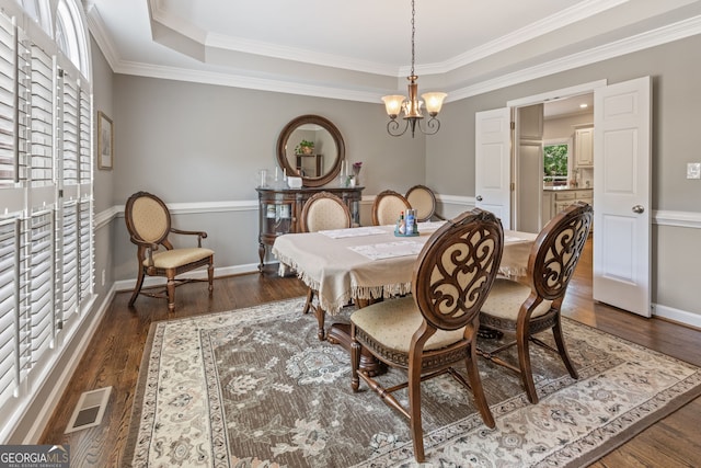 420 Windswept Ct, Roswell, GA 30075 - dining room with crown molding, wood finished floors, a chandelier, and baseboards