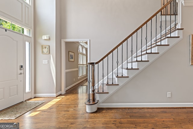420 Windswept Ct, Roswell, GA 30075 - entrance foyer featuring a towering ceiling, wood finished floors, baseboards, and stairs