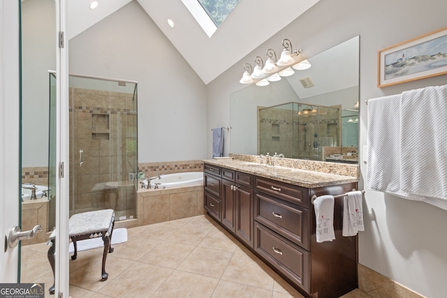 420 Windswept Ct, Roswell, GA 30075 - full bath with a skylight, tile patterned flooring, vanity, a bath, and a shower stall