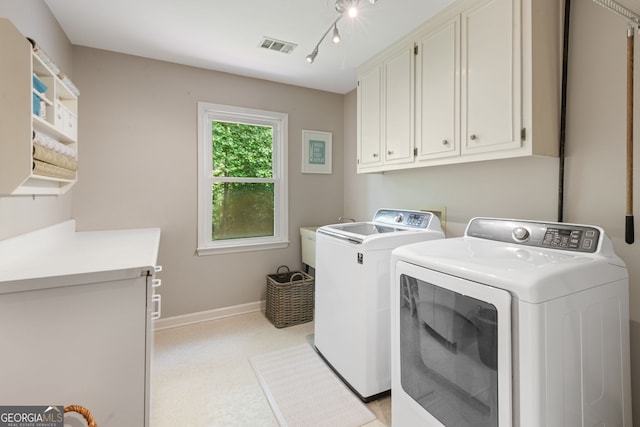 420 Windswept Ct, Roswell, GA 30075 - laundry area with cabinet space, washer and dryer, and baseboards
