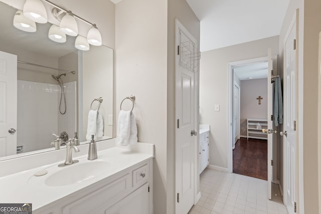 420 Windswept Ct, Roswell, GA 30075 - bathroom featuring vanity, tile patterned floors, a shower, and baseboards