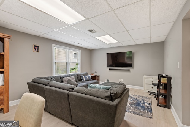 420 Windswept Ct, Roswell, GA 30075 - living room featuring light wood-style flooring, a paneled ceiling, and baseboards