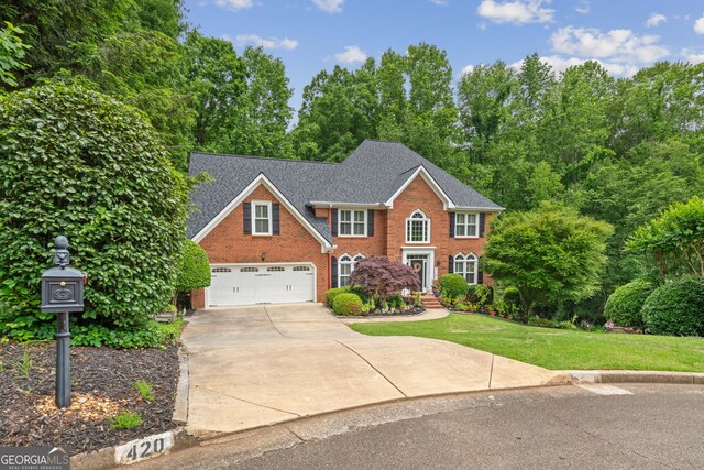 420 Windswept Ct, Roswell, GA 30075 - view of front of house featuring brick siding, driveway, an attached garage, a front yard, and a shingled roof