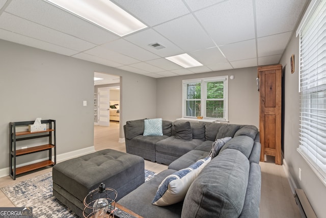 420 Windswept Ct, Roswell, GA 30075 - living area featuring a drop ceiling, wood finished floors, baseboard heating, and baseboards