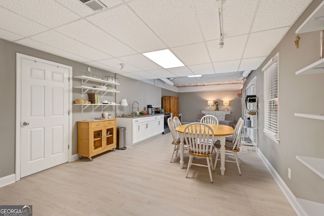 420 Windswept Ct, Roswell, GA 30075 - dining room with light wood-style flooring, a drop ceiling, and baseboards
