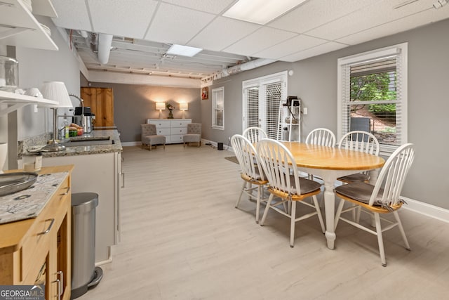 420 Windswept Ct, Roswell, GA 30075 - dining area with light wood-style floors and baseboards