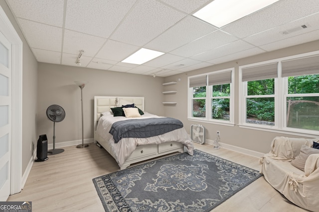 420 Windswept Ct, Roswell, GA 30075 - bedroom featuring wood finished floors, a drop ceiling, and baseboards