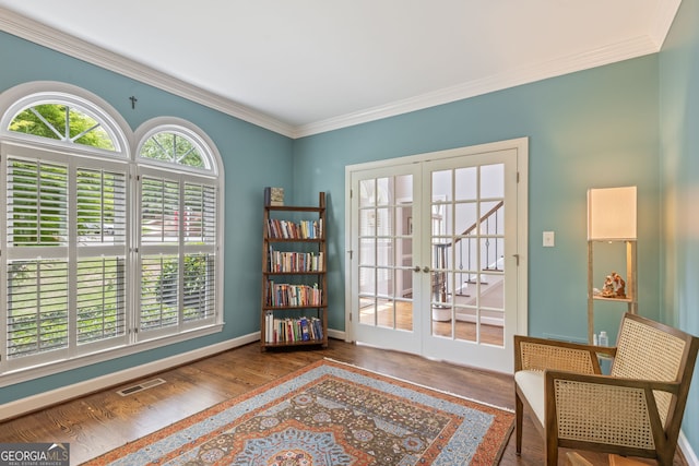 420 Windswept Ct, Roswell, GA 30075 - living area with french doors, wood finished floors, ornamental molding, and baseboards