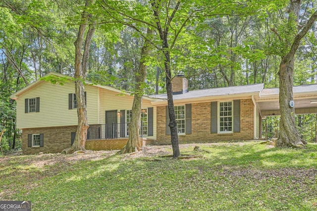 9 Windsor Way, Newnan, GA 30263 - view of front facade featuring brick siding, a chimney, and a front lawn