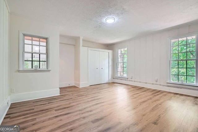 9 Windsor Way, Newnan, GA 30263 - unfurnished bedroom with a textured ceiling, wood finished floors, baseboards, and a closet
