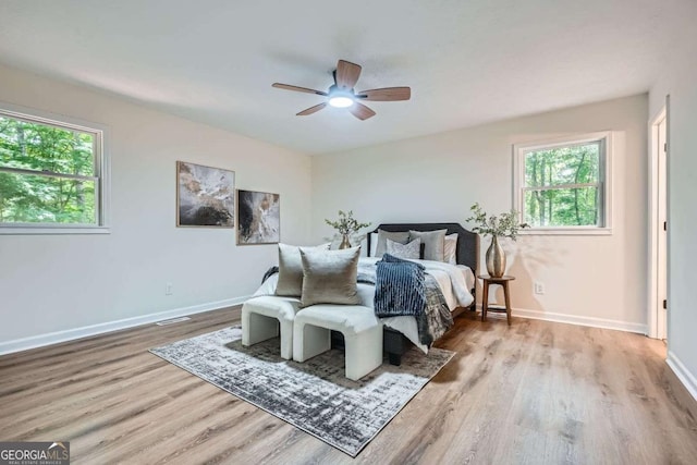 9 Windsor Way, Newnan, GA 30263 - bedroom with wood finished floors, multiple windows, baseboards, and a ceiling fan