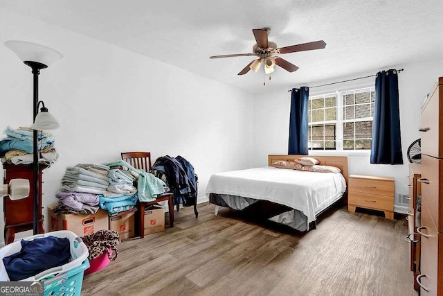 1150 Rankin St Unit 19O, Stone Mountain, GA 30083 - bedroom featuring wood finished floors and ceiling fan