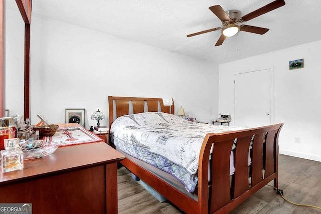 1150 Rankin St Unit 19O, Stone Mountain, GA 30083 - bedroom with wood finished floors, baseboards, and a ceiling fan