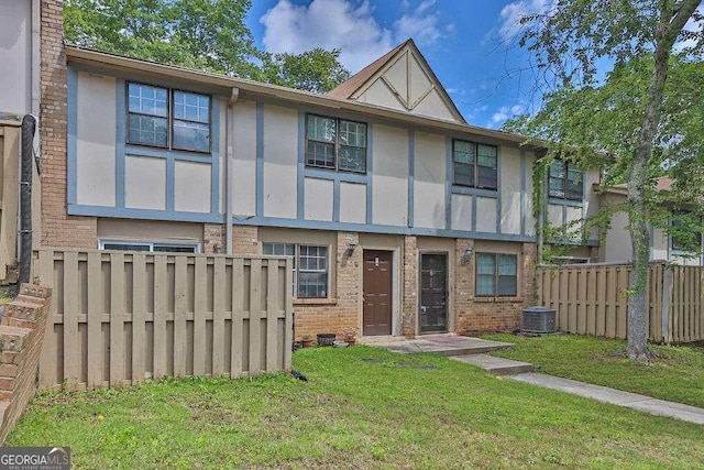 1150 Rankin St Unit 19O, Stone Mountain, GA 30083 - view of front of property featuring stucco siding, brick siding, and central air condition unit