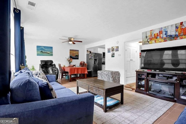1150 Rankin St Unit 19O, Stone Mountain, GA 30083 - living area featuring ceiling fan and light tile patterned floors