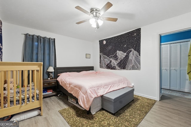 bedroom with wood finished floors and a ceiling fan