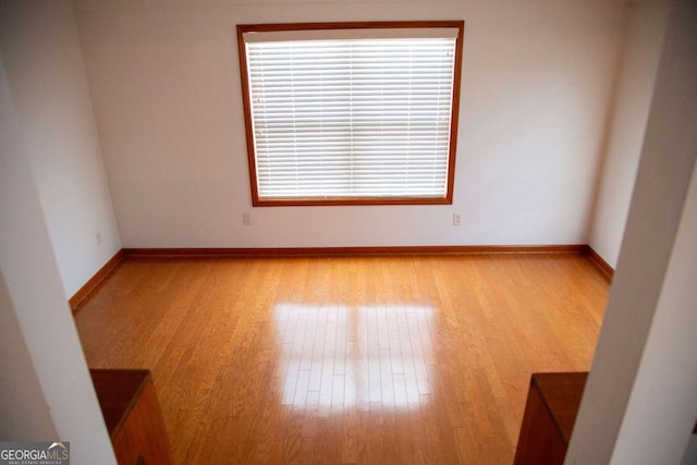 298 S Main St, Baxley, GA 31513 - spare room featuring wood finished floors and baseboards
