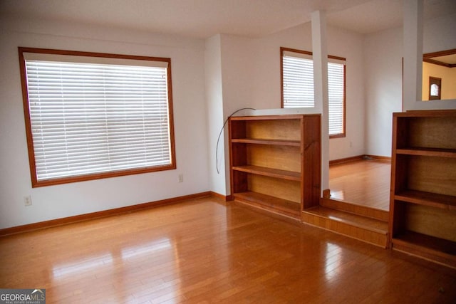 298 S Main St, Baxley, GA 31513 - bonus room featuring wood finished floors, plenty of natural light, and baseboards