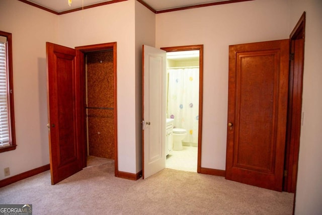 298 S Main St, Baxley, GA 31513 - unfurnished bedroom with carpet floors, ornamental molding, baseboards, and connected bathroom