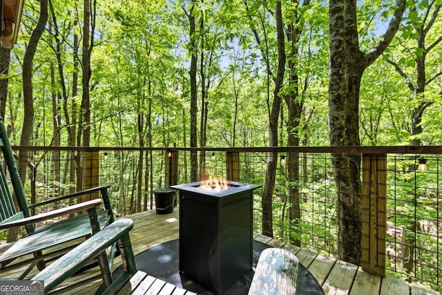 106 Taylor Ridge Rd, Blue Ridge, GA 30513 - wooden deck featuring a fire pit and a forest view