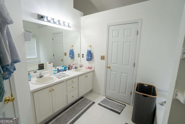 full bath with double vanity and tile patterned flooring