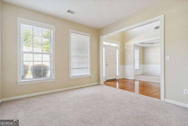 1520 Ethans Way, Mcdonough, GA 30252 - carpeted entryway with baseboards and wainscoting