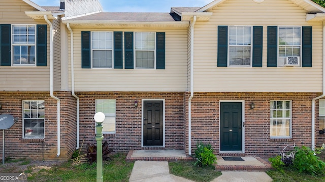 multi unit property featuring brick siding