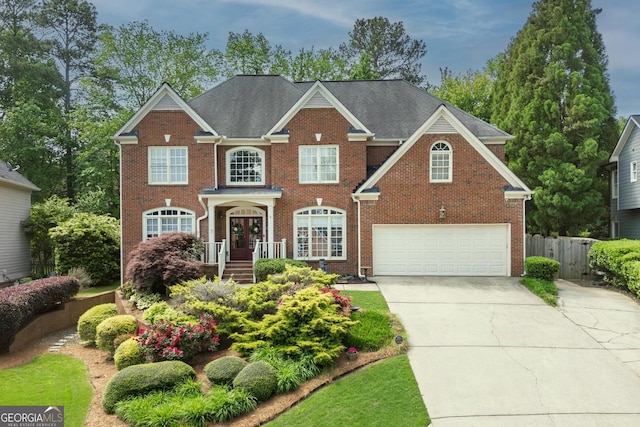 6317 Benbrooke Overlook NW, Acworth, GA 30101 - view of front of property featuring brick siding, concrete driveway, a garage, and fence