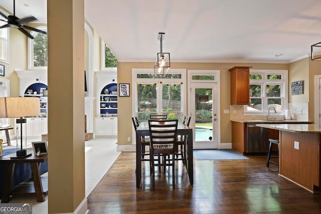 6317 Benbrooke Overlook NW, Acworth, GA 30101 - dining room featuring dark wood-style floors, a ceiling fan, crown molding, and baseboards