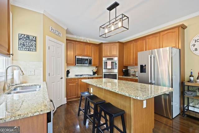 6317 Benbrooke Overlook NW, Acworth, GA 30101 - kitchen with appliances with stainless steel finishes, a sink, light stone countertops, dark wood-type flooring, and ornamental molding