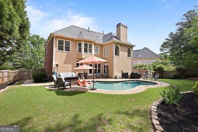 6317 Benbrooke Overlook NW, Acworth, GA 30101 - back of property featuring an outdoor living space, a chimney, a fenced backyard, and a patio