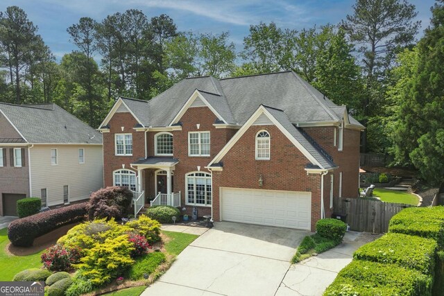 6317 Benbrooke Overlook NW, Acworth, GA 30101 - colonial house with an attached garage, driveway, and brick siding