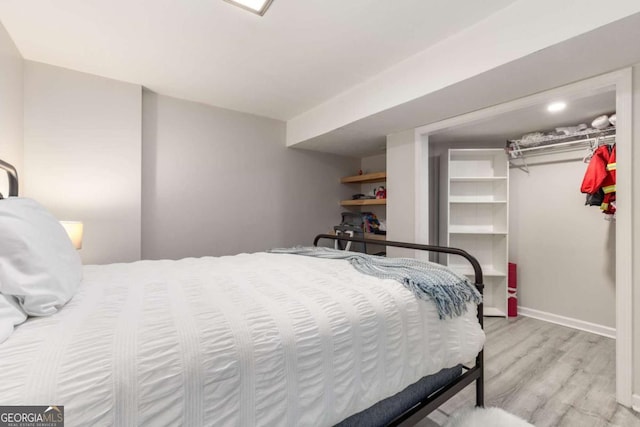 3890 Cherrydale Ln SE, Smyrna, GA 30082 - bedroom featuring wood finished floors, baseboards, and a closet