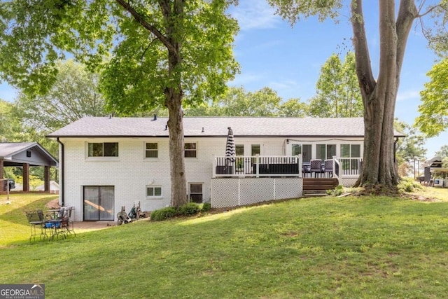 3890 Cherrydale Ln SE, Smyrna, GA 30082 - back of property featuring a lawn, brick siding, and a deck