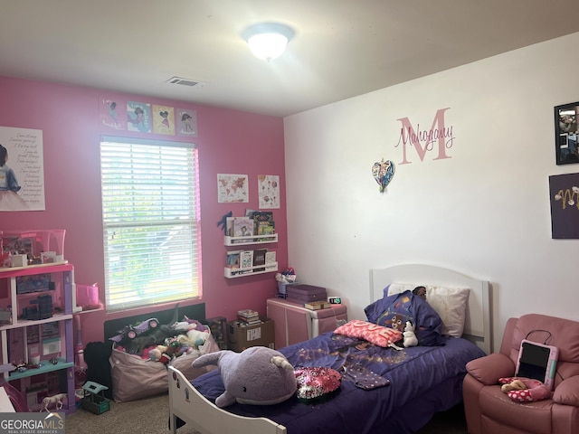 carpeted bedroom featuring multiple windows