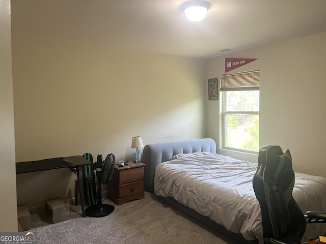 bedroom featuring light carpet