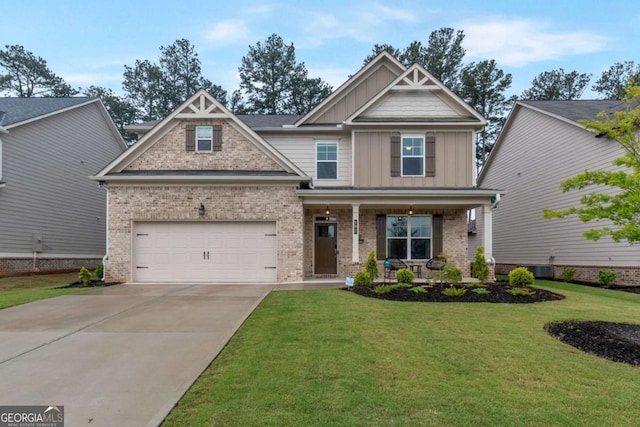 592 Eagles Nest Cir, Auburn, GA 30011 - craftsman house featuring board and batten siding, covered porch, brick siding, concrete driveway, and a front lawn