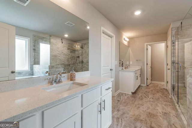 592 Eagles Nest Cir, Auburn, GA 30011 - full bath with a shower stall, two vanities, recessed lighting, and baseboards