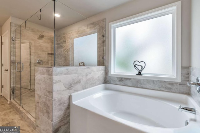 592 Eagles Nest Cir, Auburn, GA 30011 - full bath featuring a shower stall and a bath