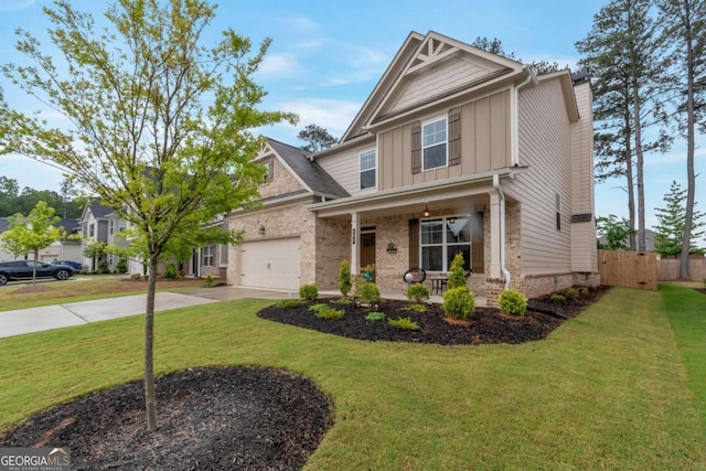 592 Eagles Nest Cir, Auburn, GA 30011 - craftsman-style house with board and batten siding, a porch, driveway, a garage, and brick siding