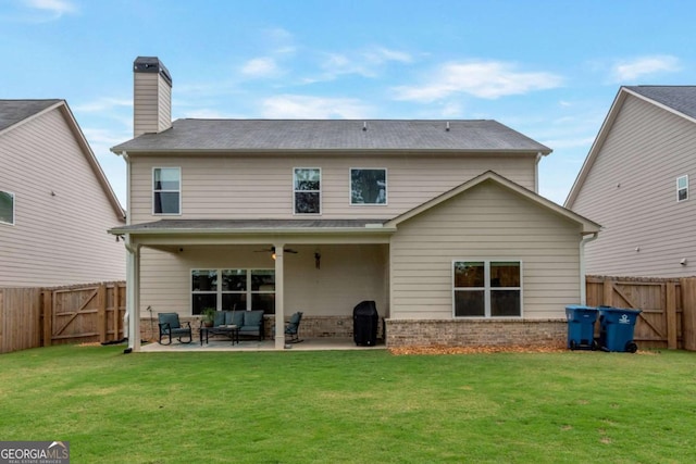 592 Eagles Nest Cir, Auburn, GA 30011 - rear view of property with a gate, outdoor lounge area, a patio area, ceiling fan, and a chimney