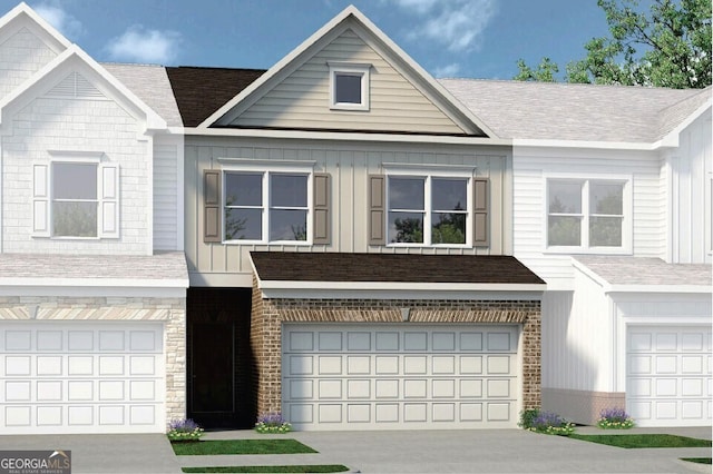 14 Jacobs Farm Ln Unit 7, Lawrenceville, GA 30045 - view of front of home with an attached garage, stone siding, board and batten siding, and driveway