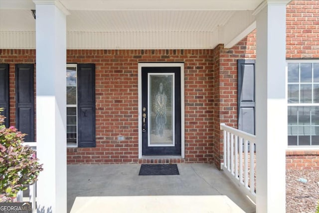 500 Wyckfield Way, Hinesville, GA 31313 - doorway to property featuring brick siding and a porch