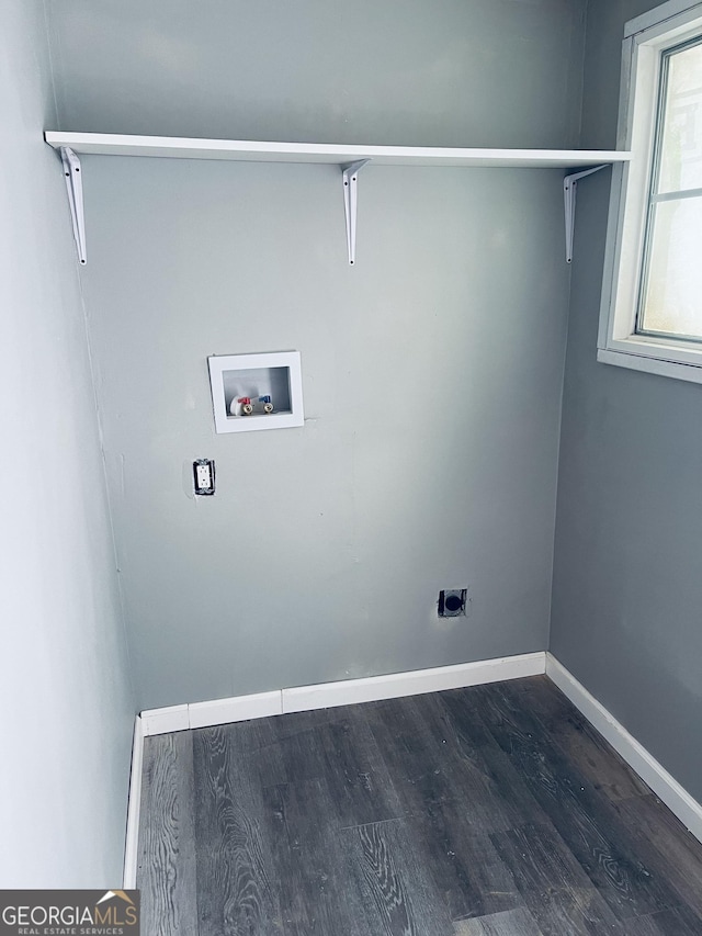 laundry room featuring hookup for a washing machine, hookup for an electric dryer, dark wood-style flooring, and baseboards