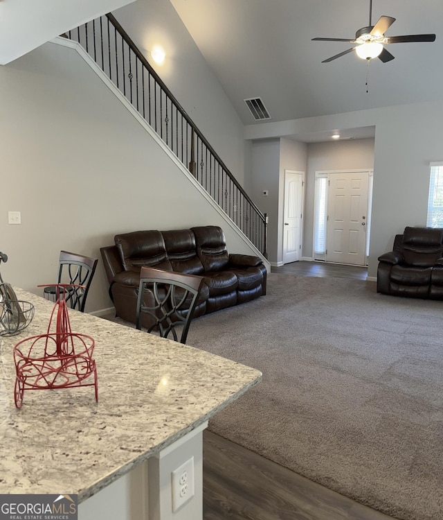 457 Panhandle Pl, Hampton, GA 30228 - living area with a ceiling fan, stairway, dark wood finished floors, and a high ceiling