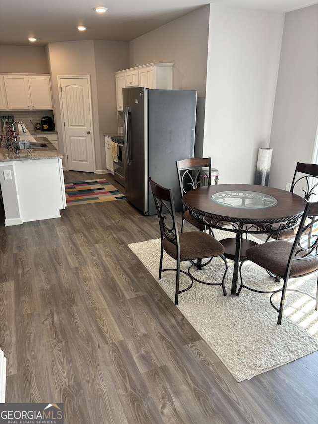 457 Panhandle Pl, Hampton, GA 30228 - dining room with dark wood finished floors and recessed lighting