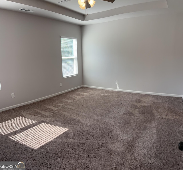 457 Panhandle Pl, Hampton, GA 30228 - unfurnished room with ceiling fan, a raised ceiling, carpet floors, and baseboards